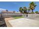 This backyard features concrete, block wall, artificial turf, and palm trees at 5417 Eastbrook Dr, Las Vegas, NV 89142