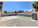 The backyard features a concrete and brick patio, privacy fence and a small grassy area at 5417 Eastbrook Dr, Las Vegas, NV 89142