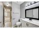Bathroom featuring a modern vanity, toilet, and combined shower-tub as viewed from doorway at 5417 Eastbrook Dr, Las Vegas, NV 89142