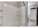 Clean bathroom featuring tiled walls, tub, and built in shelf at 5417 Eastbrook Dr, Las Vegas, NV 89142