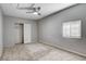 This bedroom features neutral walls, carpeted floors, ceiling fan, closet with doors, and window at 5417 Eastbrook Dr, Las Vegas, NV 89142