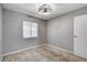 Bedroom featuring a window and modern ceiling fan at 5417 Eastbrook Dr, Las Vegas, NV 89142