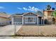Charming single-story home with a fenced yard and modern architectural details at 5417 Eastbrook Dr, Las Vegas, NV 89142