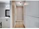 Hallway view including bathroom with modern black fixtures and large storage cabinets at 5417 Eastbrook Dr, Las Vegas, NV 89142