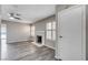 Cozy living room features a fireplace, wood-look flooring, and plantation shutters at 5417 Eastbrook Dr, Las Vegas, NV 89142