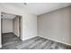 A neutral colored room featuring vinyl wood flooring and easy access to other parts of the home at 5417 Eastbrook Dr, Las Vegas, NV 89142