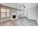Comfortable living room with a decorative fireplace, shutters and ample natural light at 5417 Eastbrook Dr, Las Vegas, NV 89142