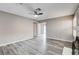 Open-concept living room featuring stylish gray floors, and a neutral color palette at 5417 Eastbrook Dr, Las Vegas, NV 89142