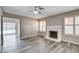 Living room featuring wood floors, a fireplace and large sliding glass doors to a patio at 5417 Eastbrook Dr, Las Vegas, NV 89142