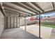 This spacious patio with a fan, concrete flooring, and block wall offers a great space for entertaining at 5417 Eastbrook Dr, Las Vegas, NV 89142