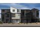 Modern townhome showcasing a sleek architectural design and neutral color palette at 5872 Wisteria Walk, Las Vegas, NV 89148