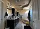 Bright primary bathroom with double sinks, vanity and step-up tub with enclosed shower at 6454 Mount Palomar Ave, Las Vegas, NV 89139