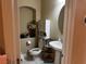 Well-maintained half bathroom with pedestal sink and decorative accents at 6454 Mount Palomar Ave, Las Vegas, NV 89139