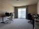 Large bedroom with dual desks and large windows offering lots of natural light at 6454 Mount Palomar Ave, Las Vegas, NV 89139