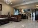 Elegant living room with tile floors, chandelier, and decorative curtains at 6454 Mount Palomar Ave, Las Vegas, NV 89139
