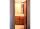Bathroom featuring tile floor and wood cabinets at 671 Bourbon St, Pahrump, NV 89048