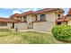 Exterior shows two-story home with manicured lawn and red tile roof at 671 Bourbon St, Pahrump, NV 89048