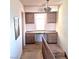 Upstairs hallway with desk, cabinets and natural light at 671 Bourbon St, Pahrump, NV 89048