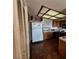 The kitchen has updated appliances, a refrigerator, a sink and a pantry at 671 Bourbon St, Pahrump, NV 89048