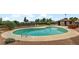 In-ground pool with blue water at 671 Bourbon St, Pahrump, NV 89048