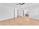 Spacious bedroom with wood floors, ceiling fan, and ensuite bathroom at 6717 Sheffield Dr, Las Vegas, NV 89108