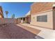 Exterior view of house with rock landscaping in backyard at 6717 Sheffield Dr, Las Vegas, NV 89108