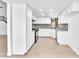 Well-lit kitchen featuring white cabinetry, granite countertops, and stainless steel appliances at 6717 Sheffield Dr, Las Vegas, NV 89108