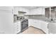 Modern kitchen with stainless steel appliances, granite countertops, and ample cabinet space at 6717 Sheffield Dr, Las Vegas, NV 89108