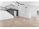 Spacious living room with tile flooring, ceiling fan, and stairs leading to the second floor at 6717 Sheffield Dr, Las Vegas, NV 89108