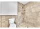 Newly tiled shower with a built-in shower head and corner shelves at 6717 Sheffield Dr, Las Vegas, NV 89108