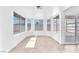 Bright sun room featuring tile floor, multiple windows, and access to the backyard at 6717 Sheffield Dr, Las Vegas, NV 89108