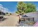 Private backyard with mature landscaping, play area, and secure fencing, perfect for outdoor activities at 6821 Jeanette St, Las Vegas, NV 89131