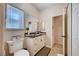 Bathroom features include a vanity sink, toilet, and a window providing natural light and ventilation at 6821 Jeanette St, Las Vegas, NV 89131