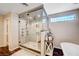 Modern bathroom with a glass-enclosed shower and a soaking tub at 6821 Jeanette St, Las Vegas, NV 89131