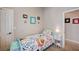 Charming bedroom with a window, bedside table, and colorful decorations at 6821 Jeanette St, Las Vegas, NV 89131