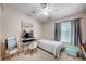 Bright bedroom with a window, desk space, and simple decor at 6821 Jeanette St, Las Vegas, NV 89131