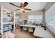 Bright craft room with a ceiling fan, large window, and custom shelving at 6821 Jeanette St, Las Vegas, NV 89131