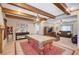 Large game room with beamed ceilings, tile flooring, and open layout at 6821 Jeanette St, Las Vegas, NV 89131