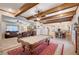 Versatile game room with beamed ceilings, a pool table, and seamless connection to the kitchen at 6821 Jeanette St, Las Vegas, NV 89131