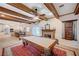 Open-concept layout with a game table, kitchen, and dining area, perfect for entertaining at 6821 Jeanette St, Las Vegas, NV 89131