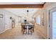 Bright kitchen with a large center island, wooden beam accents and modern pendant lighting at 6821 Jeanette St, Las Vegas, NV 89131