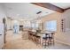 Bright, open eat-in kitchen showcasing an island with barstool seating and modern pendant lighting at 6821 Jeanette St, Las Vegas, NV 89131