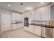 Well-lit kitchen featuring updated cabinetry, stainless steel appliances, and tile flooring at 6821 Jeanette St, Las Vegas, NV 89131