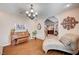 Charming living room showcasing a piano, chandelier lighting, and a cozy chaise lounge for relaxation at 6821 Jeanette St, Las Vegas, NV 89131