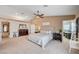 Spacious main bedroom featuring a ceiling fan, a large dresser, and an attached craft room at 6821 Jeanette St, Las Vegas, NV 89131