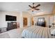 Bright main bedroom with vaulted ceiling, TV, and access to the upper floor landing at 6821 Jeanette St, Las Vegas, NV 89131
