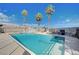Backyard oasis with a spacious pool and spa, surrounded by tall palm trees at 6821 Jeanette St, Las Vegas, NV 89131