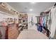 Walk-in closet with custom shelving and a large dresser at 6821 Jeanette St, Las Vegas, NV 89131