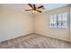 Standard bedroom with carpet and a ceiling fan, ready for personalization and comfort at 7382 Elbridge Way, Las Vegas, NV 89113