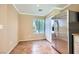 Cozy kitchen area with stainless steel refrigerator, tile floors, and a bright window at 7382 Elbridge Way, Las Vegas, NV 89113